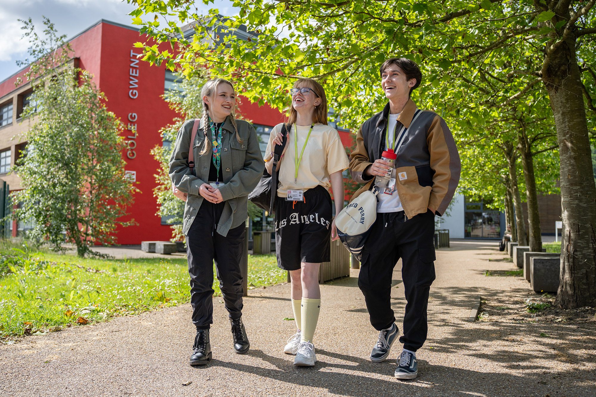 Three students walking outside Crosskeys campus.