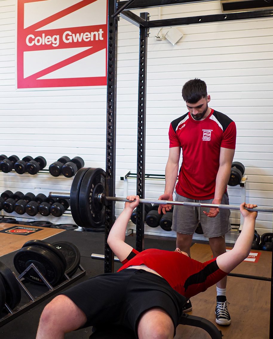 Students using weights at Crosskeys sports facility