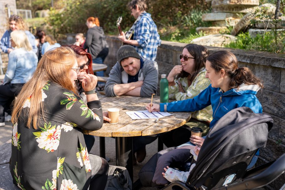 Welsh for adults students at picnic bench outside
