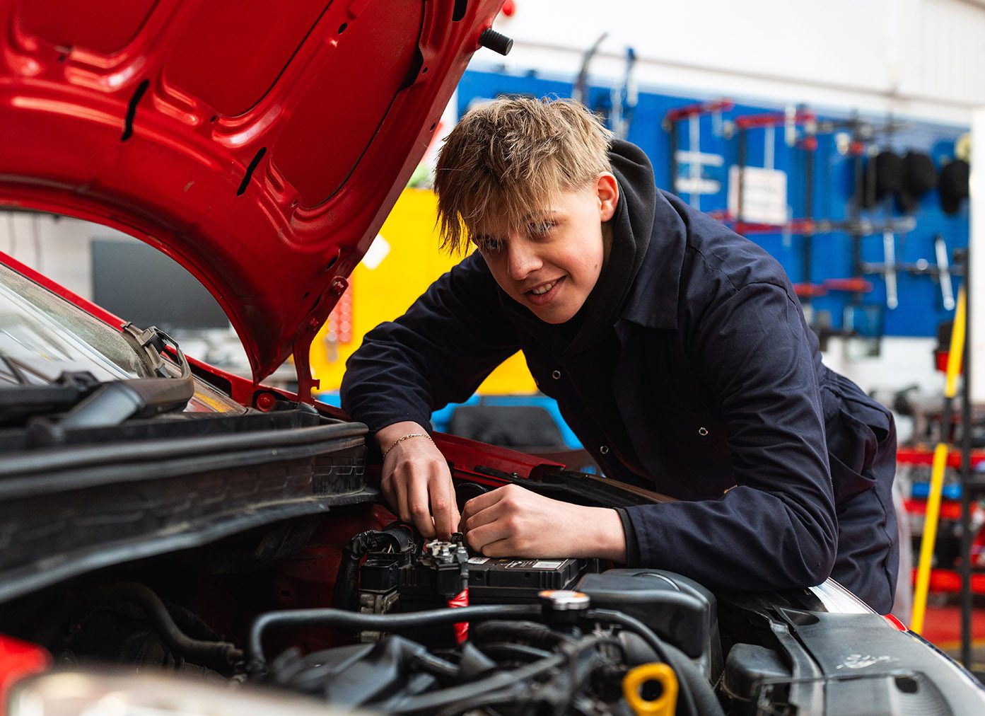 Student working on car