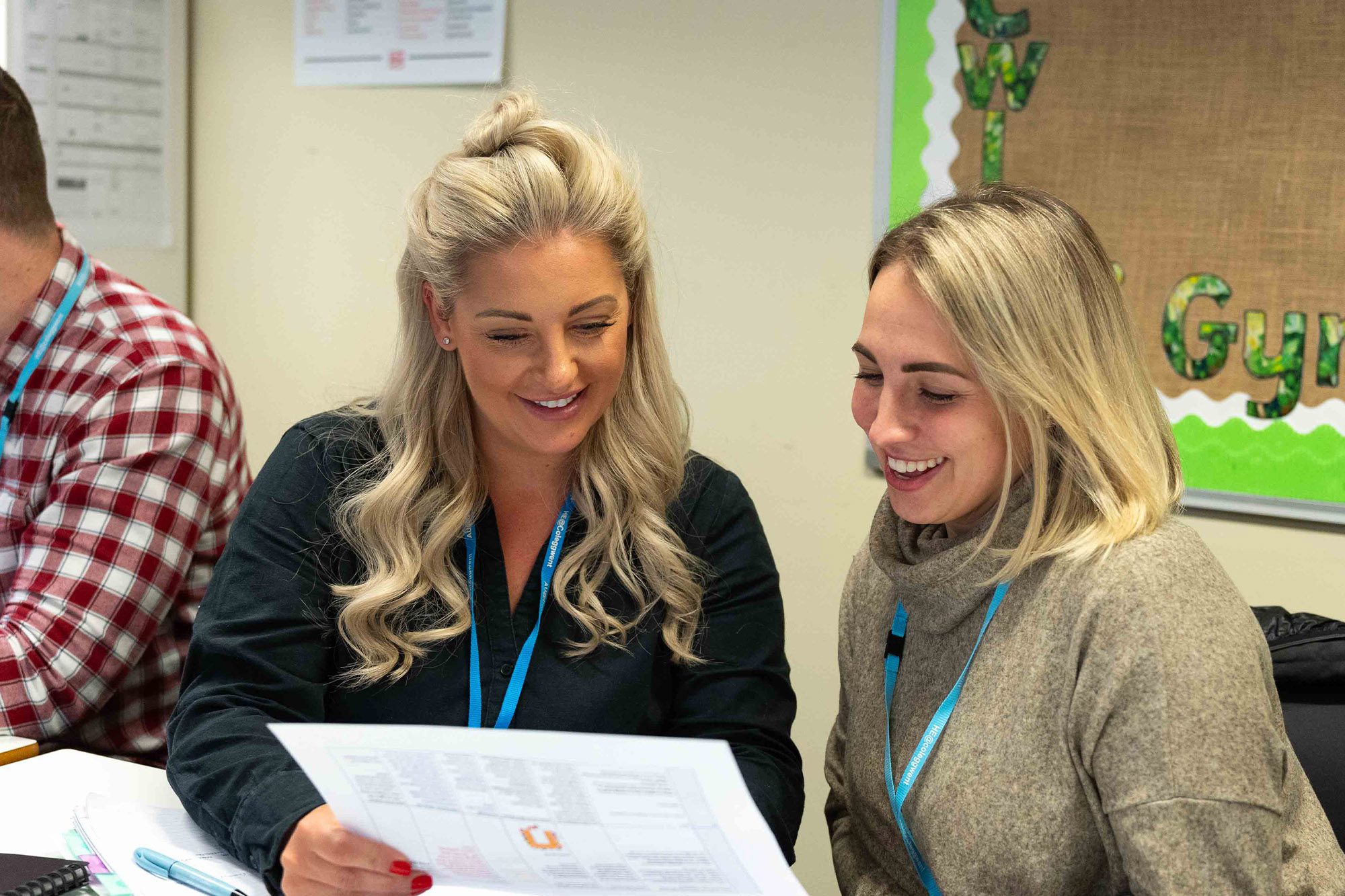 Teaching students smiling in class