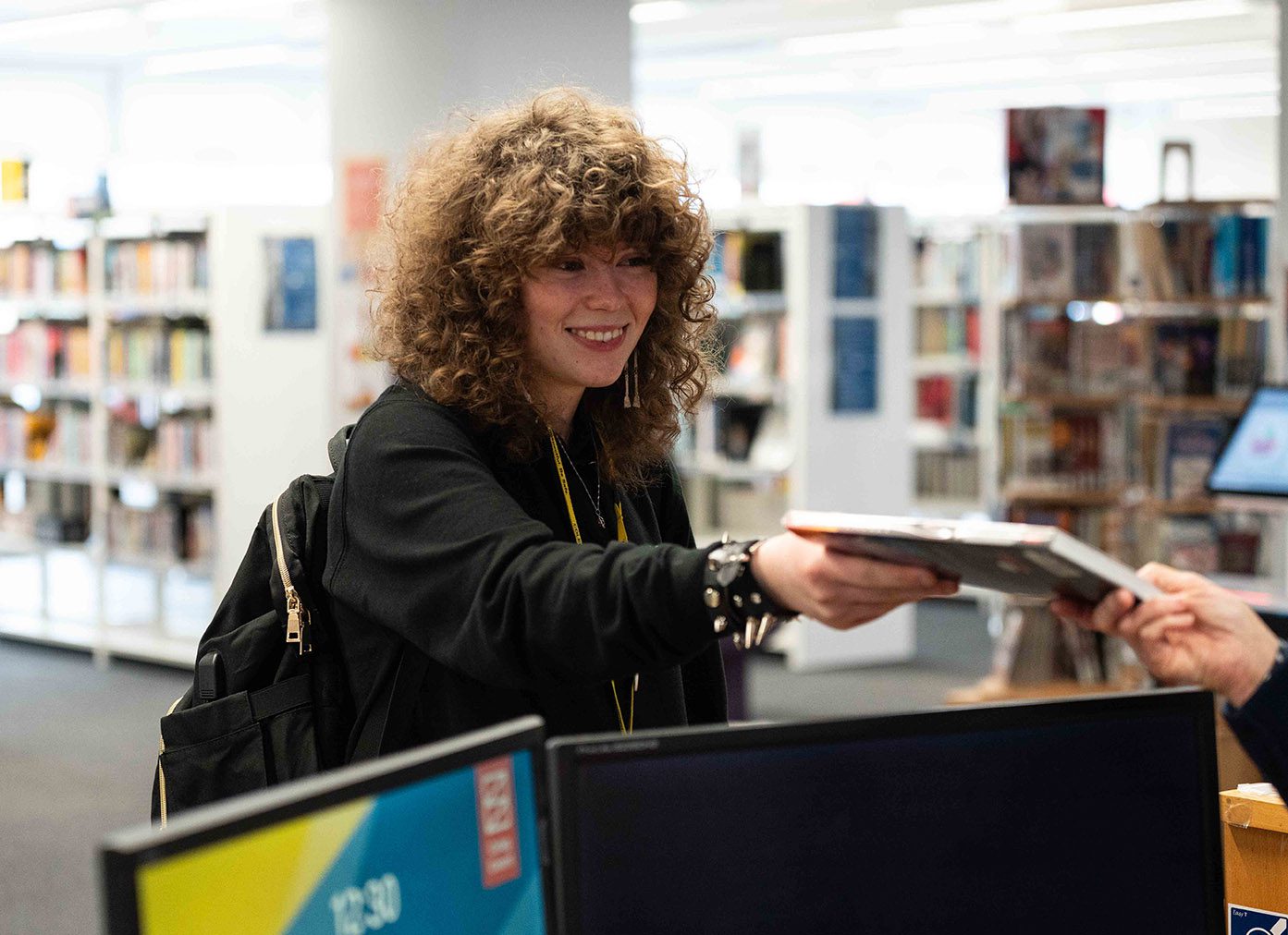 Student-Smiling-in-Library
