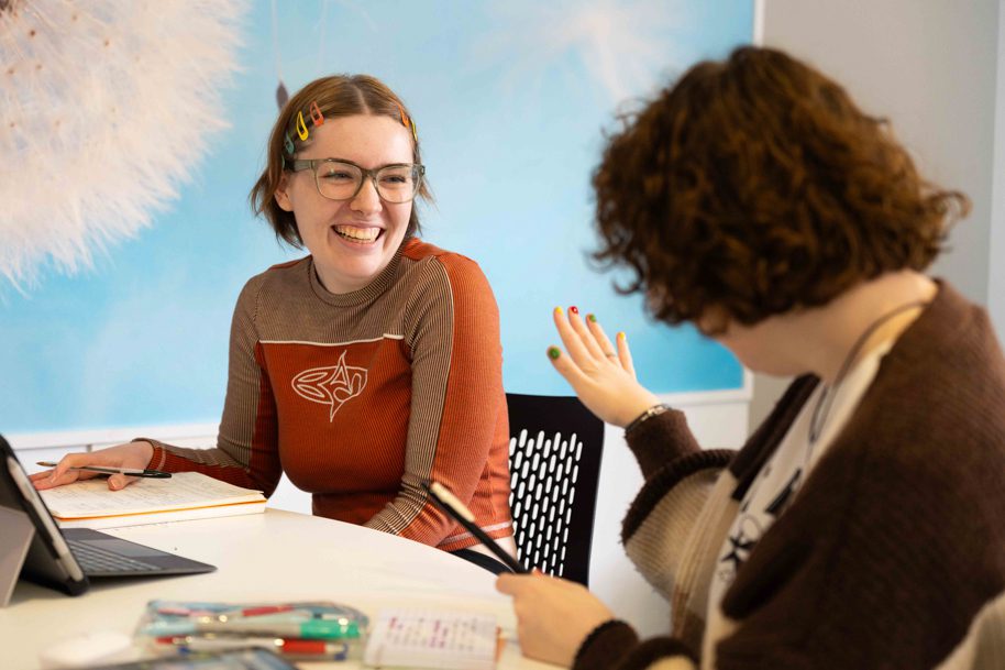 Students using HE Hub interior Usk