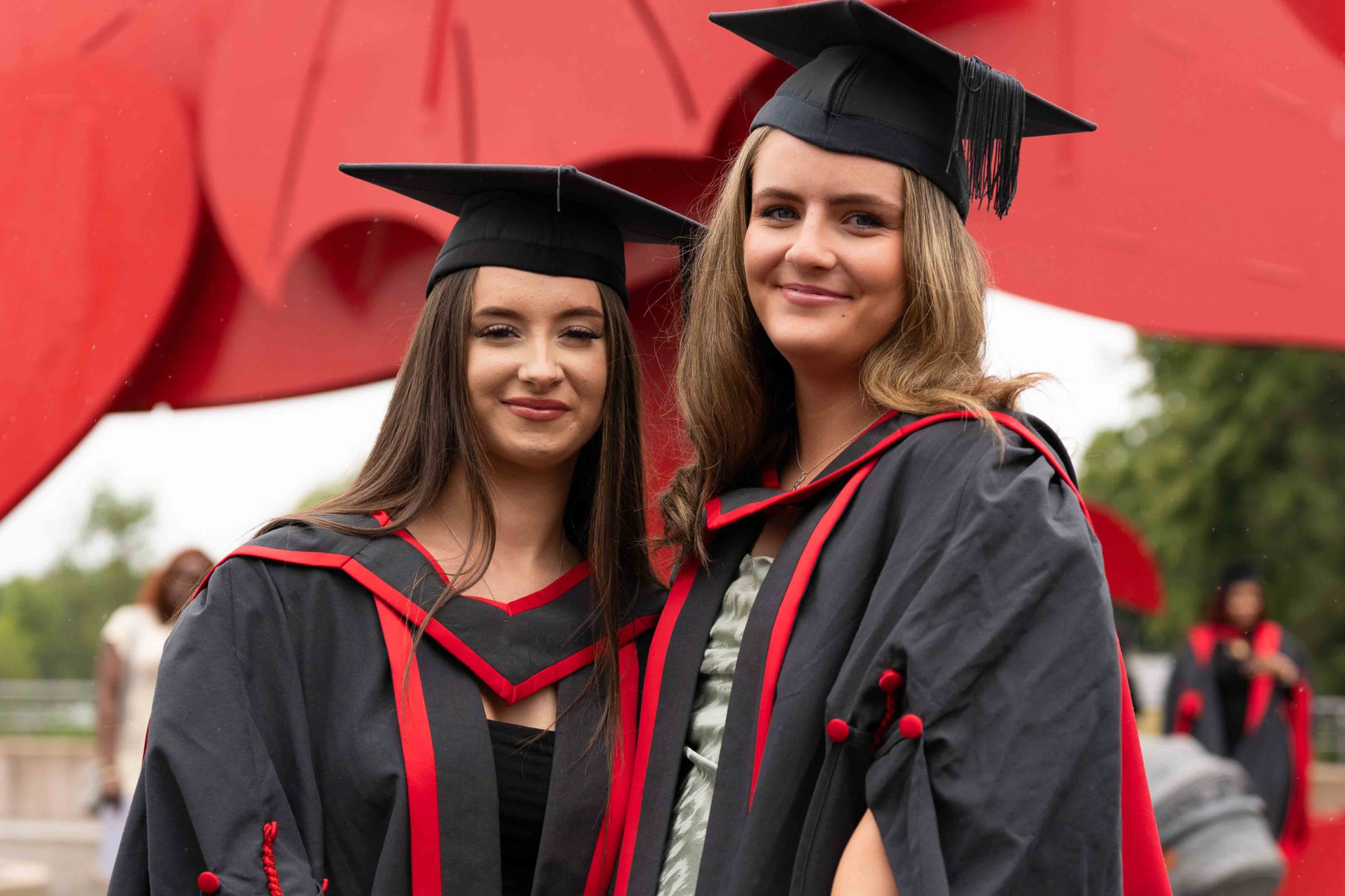 Students wearing gowns at graduation