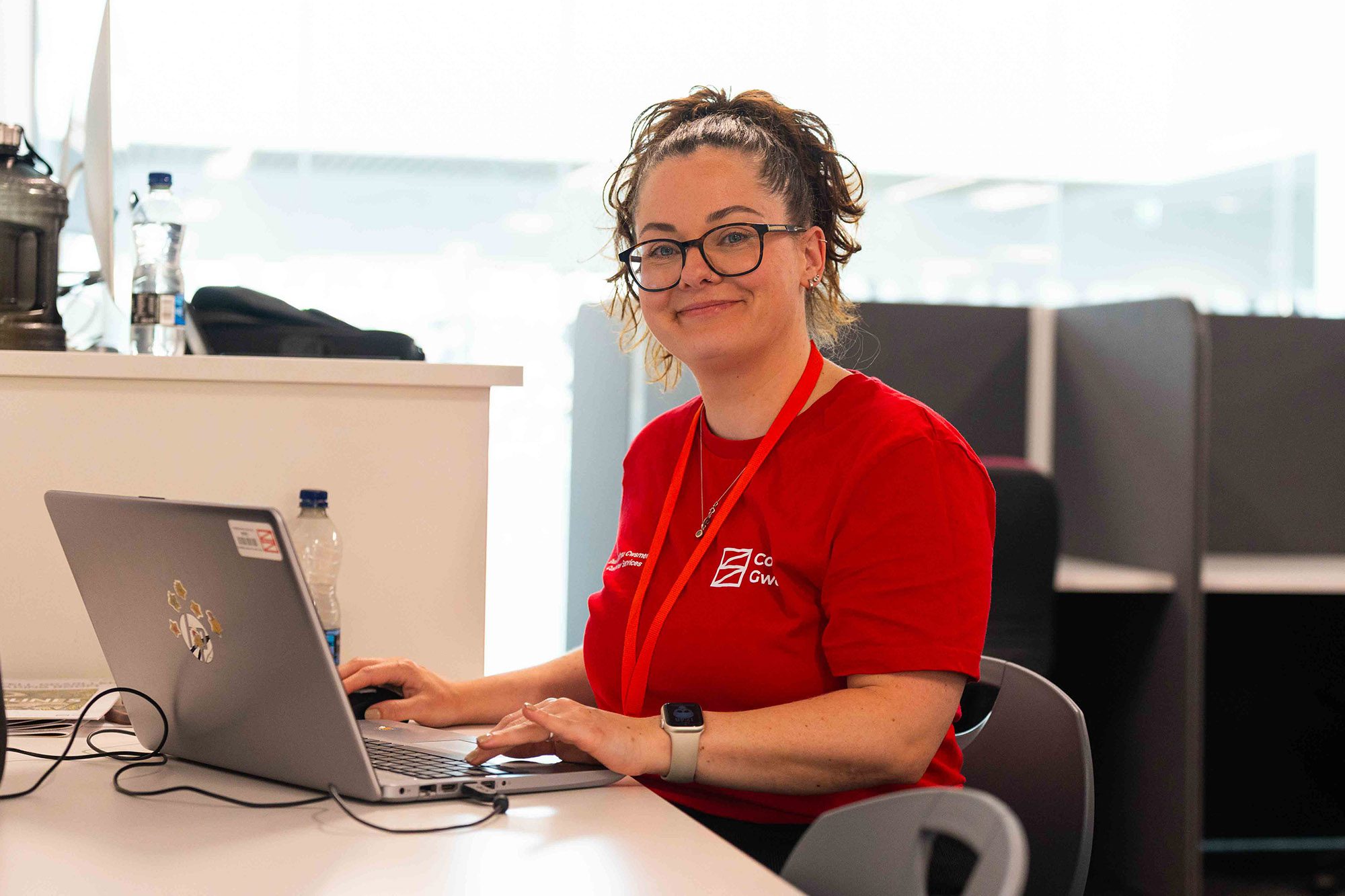 Customer Services staff member smiling