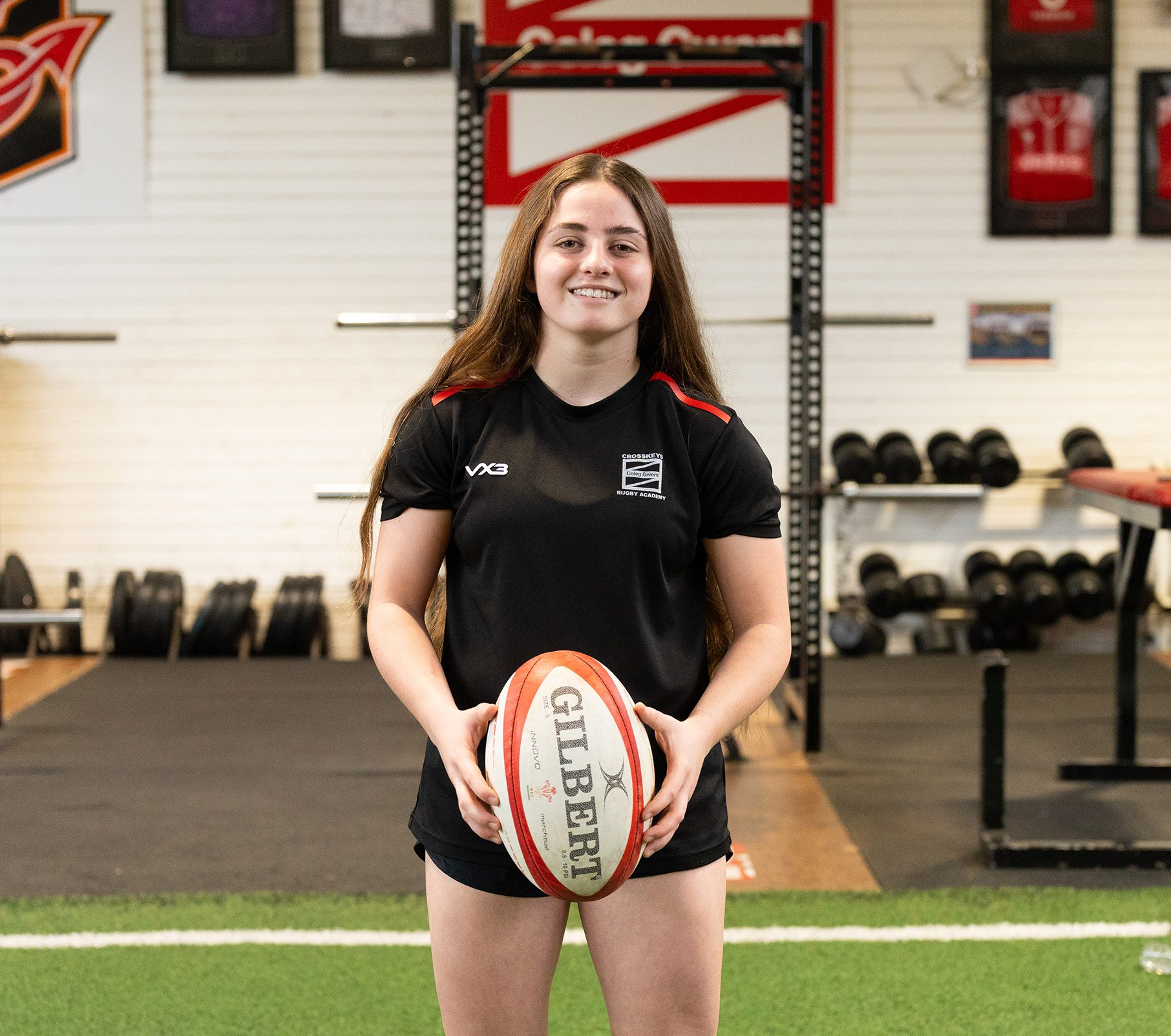 Lily holding Rugby ball - IWD