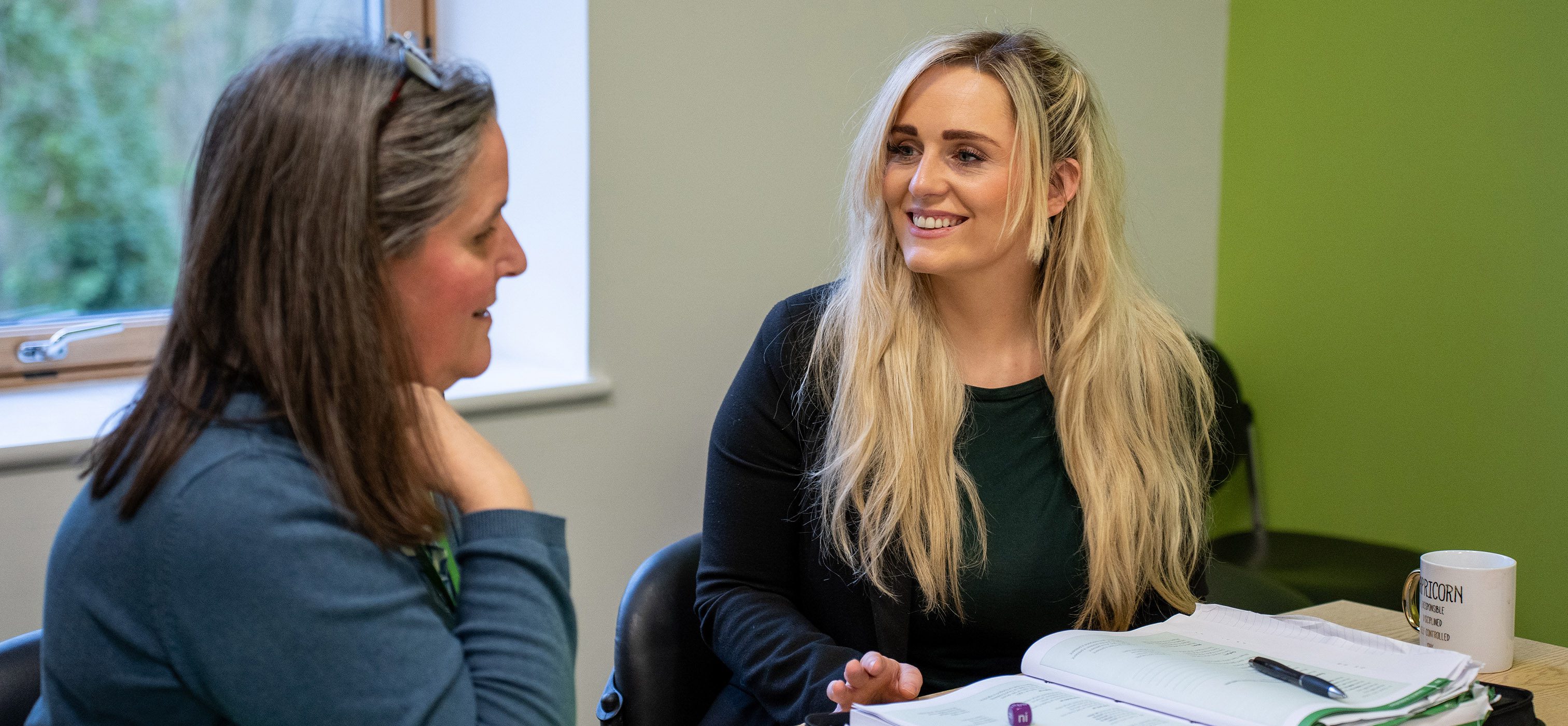 Part time student talking to tutor
