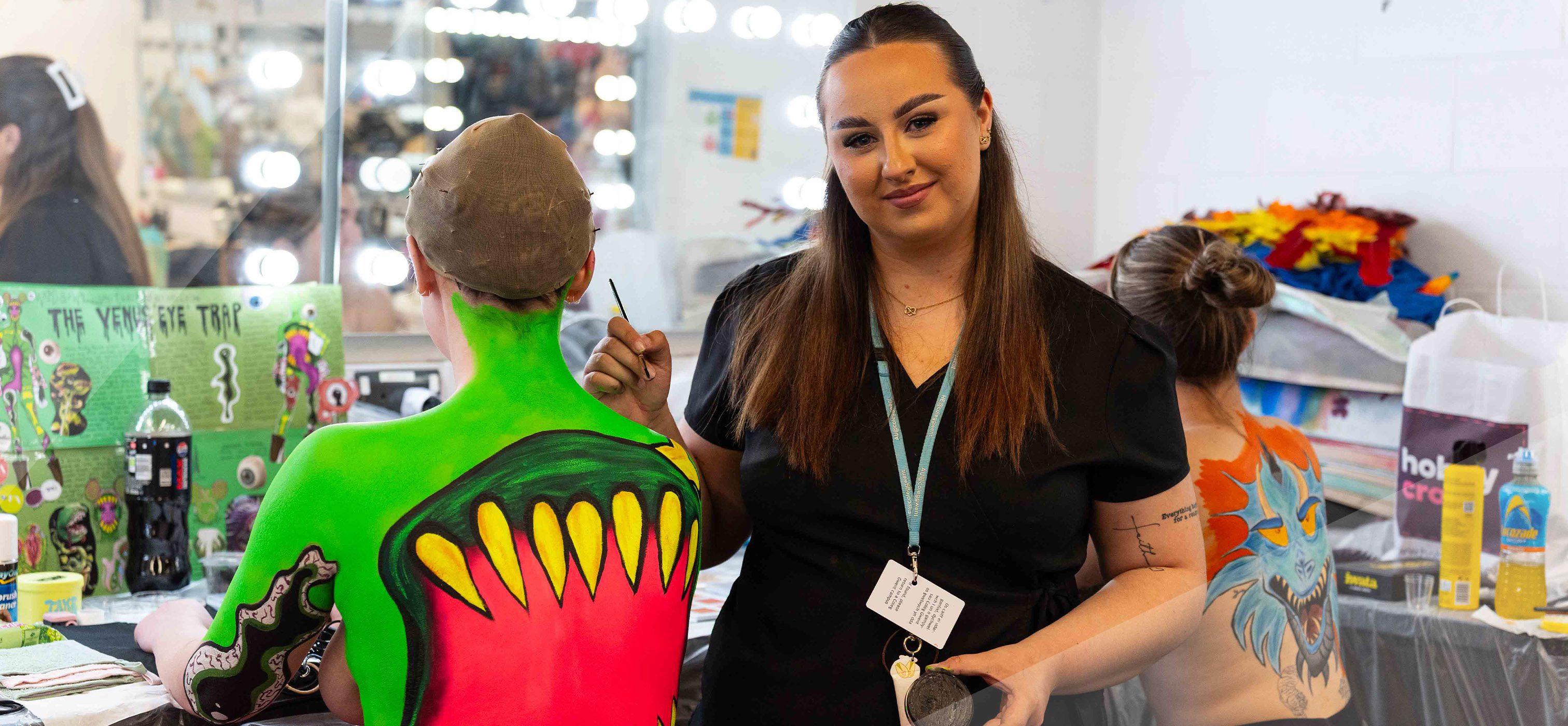 Student working on body art